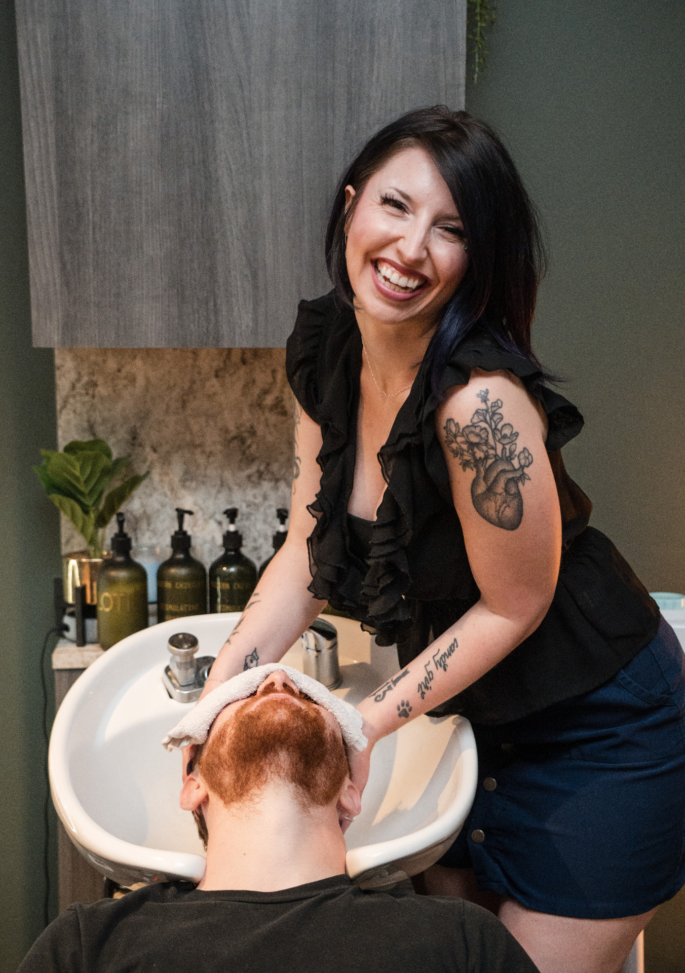Rachel, Modern Chivalry stylist, at the shampoo bowl