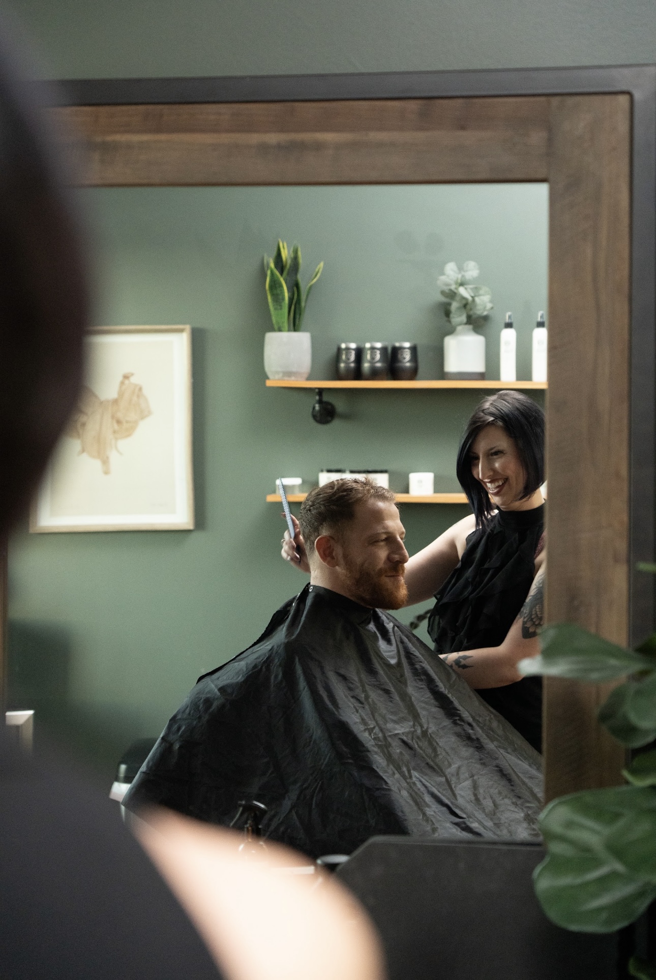 A Modern Chivalry stylist cutting a client's hair